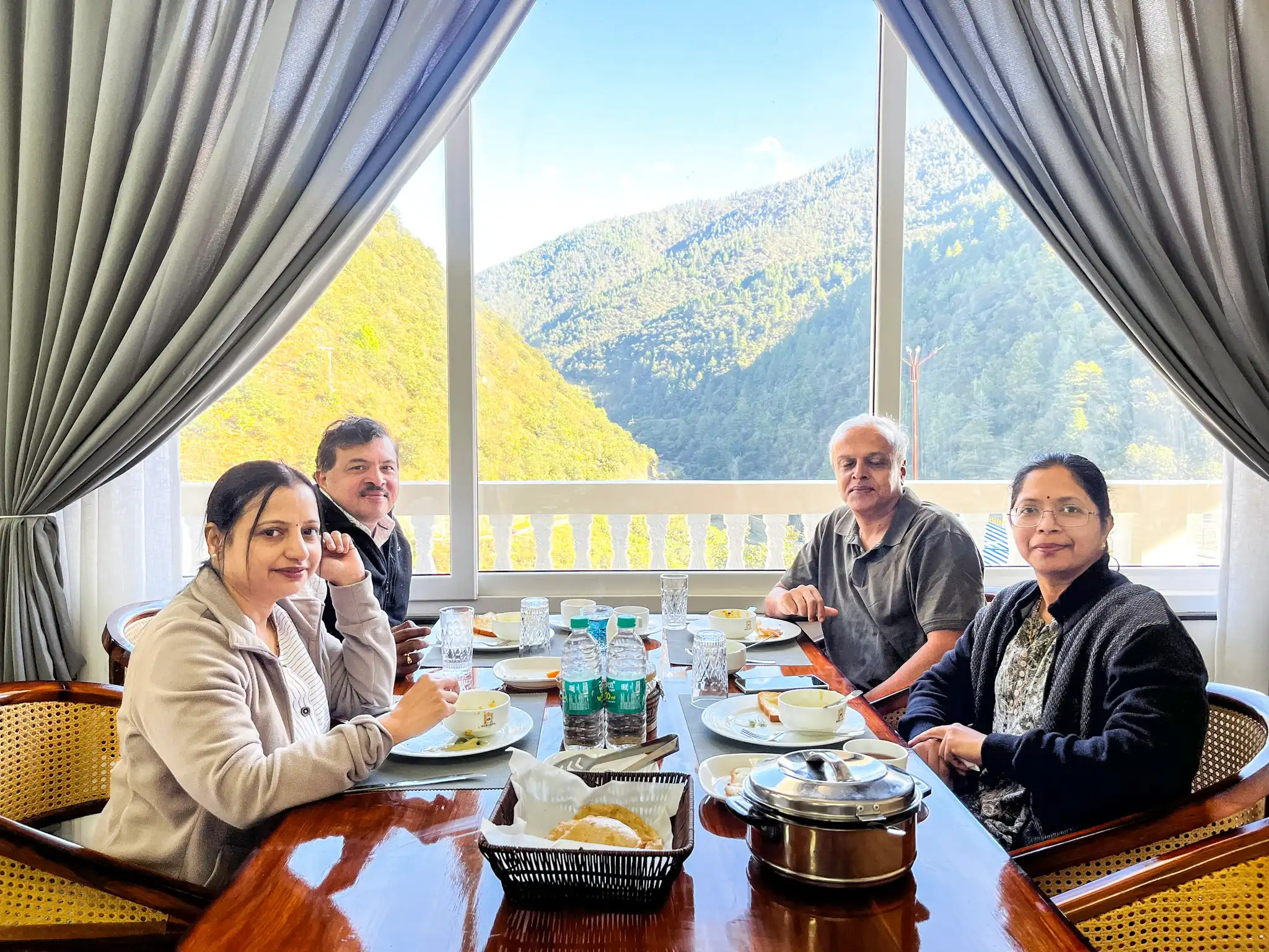 Guests enjoying breakfast at Merakpa Resort Dirang with mountain view - Best Hotel in Dirang